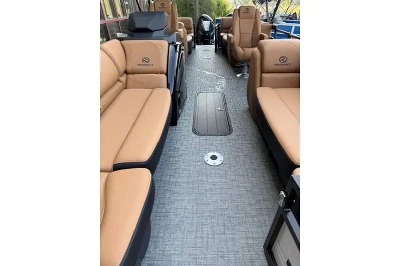 Slide: The Image of Luxurious interior of 2026 Regency 230 DL boat with tan seating and modern design. - 13