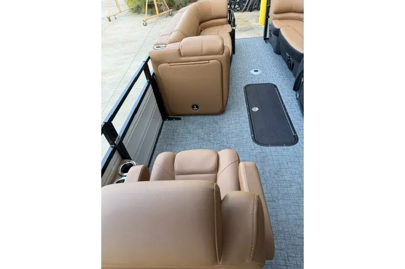 Slide: The Image of Luxurious interior of 2026 Regency 230 DL pontoon boat with tan leather seating. - 20