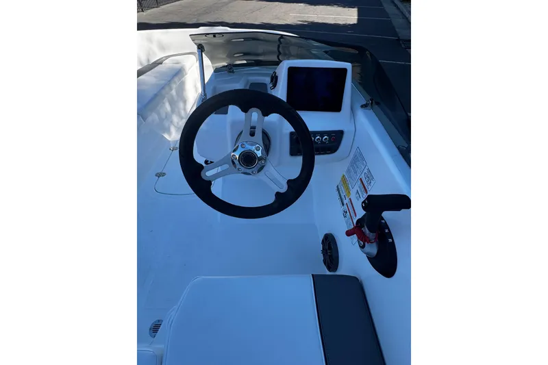 Slide: The Image of 2026 Tahoe T16 boat cockpit with steering wheel and control panel. - 6