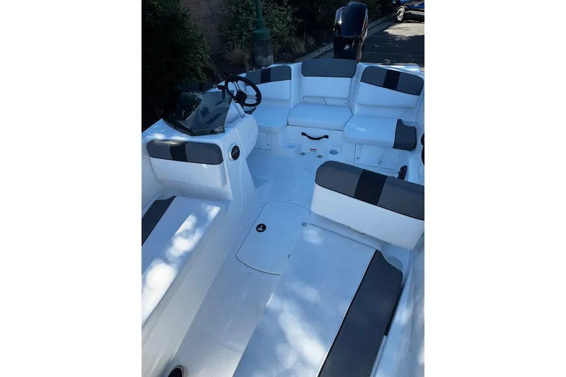 Slide: The Image of 2026 Tahoe T16 boat interior with sleek seating and modern steering console. - 10