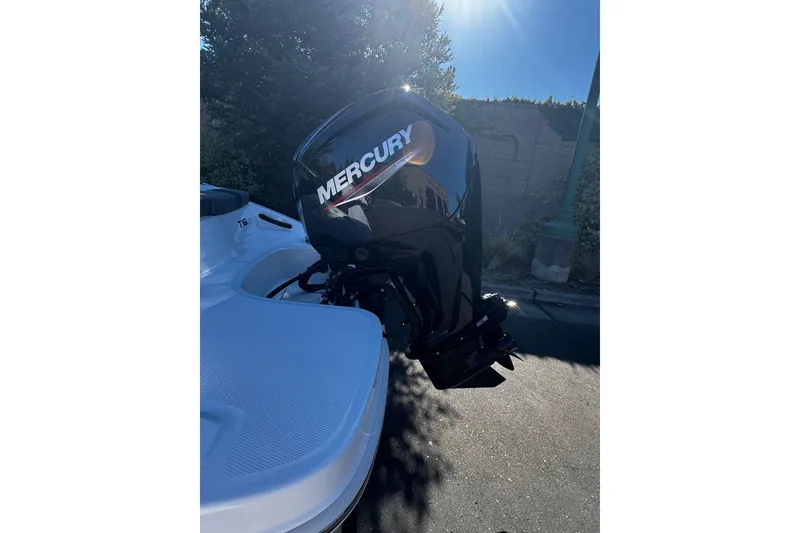 Slide: The Image of 2026 Tahoe T16 boat with Mercury outboard motor in sunlight. - 11
