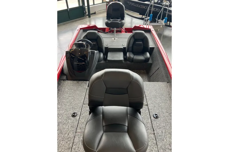 Slide: The Image of 2026 Tracker Pro Team 195 boat interior with black seats and red accents. - 7
