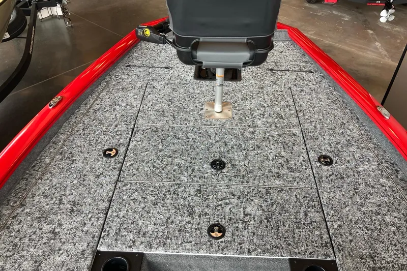 Slide: The Image of 2026 Tracker Pro Team 195 boat deck with gray carpet and red trim. - 6