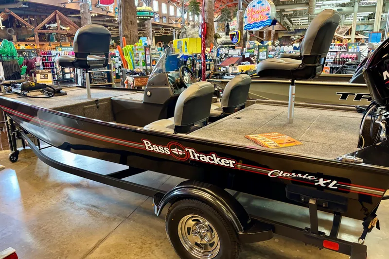 The Image of 2026 Tracker Bass Tracker Classic XL boat displayed in a showroom setting. - 0