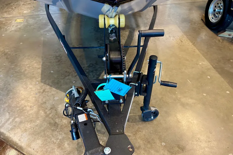 Slide: The Image of 2026 Tracker Bass Tracker Classic XL trailer hitch and winch on concrete floor. - 5