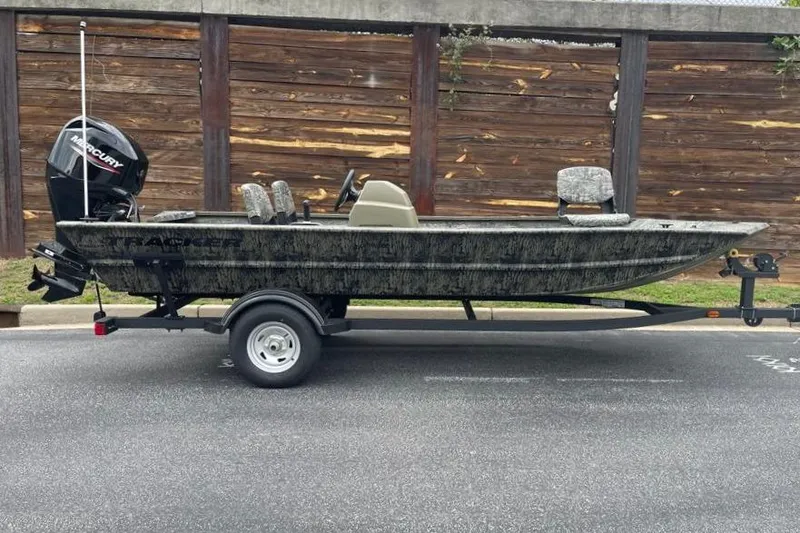The Image of 2026 Tracker Grizzly 1754 SC boat on trailer, parked outdoors. - 0