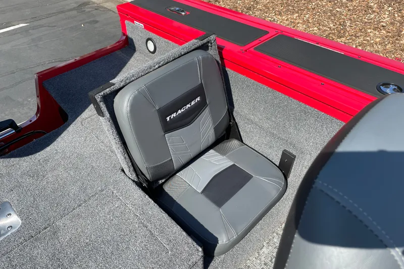 Slide: The Image of Gray seat in 2026 Tracker Targa V-18 Combo boat, red accents, outdoor setting. - 18