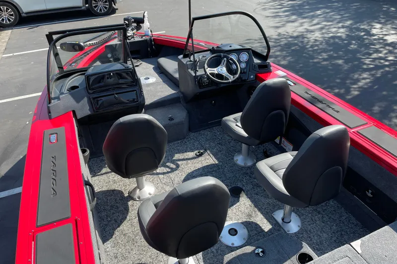 Slide: The Image of 2026 Tracker Targa V-18 Combo boat interior with four seats and steering console. - 23