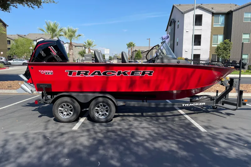 The Image of 2026 Tracker Targa V-18 Combo boat on trailer in parking lot. - 0