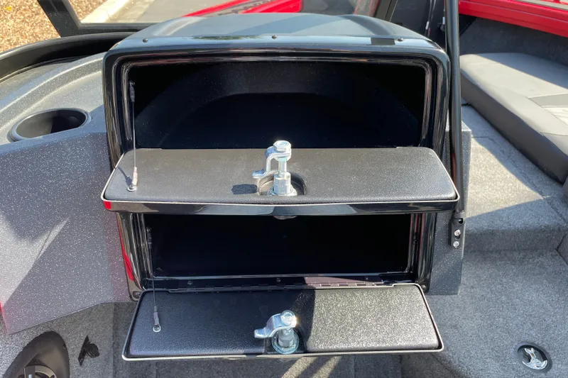 Slide: The Image of Storage compartment on 2026 Tracker Targa V-18 Combo boat, featuring secure latches and spacious interior. - 13
