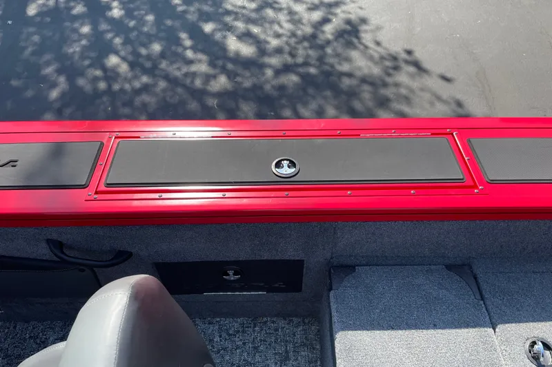 Slide: The Image of 2026 Tracker Targa V-18 Combo boat interior with red and black detailing. - 31