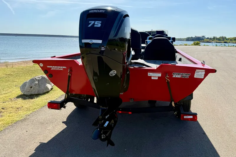 Slide: The Image of 2026 Tracker Pro Team 175 boat with Mercury 75 engine by a lake. - 13
