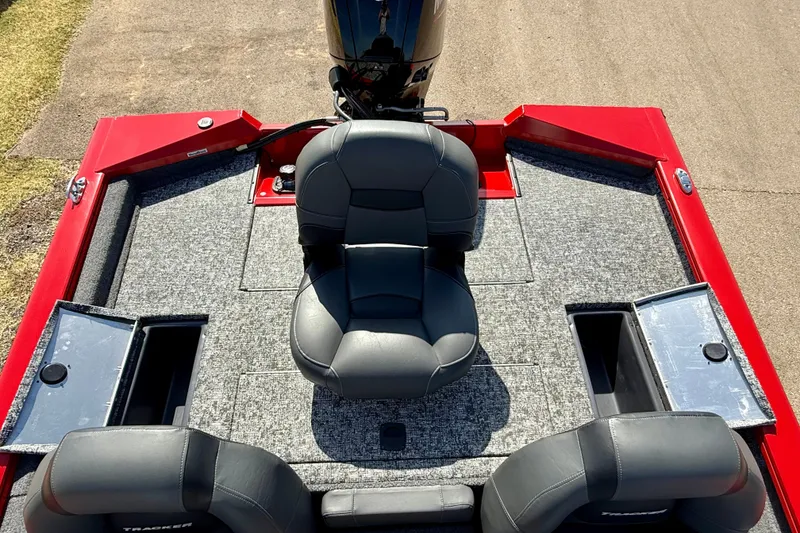Slide: The Image of 2026 Tracker Pro Team 175 boat interior with gray seating and red accents. - 17