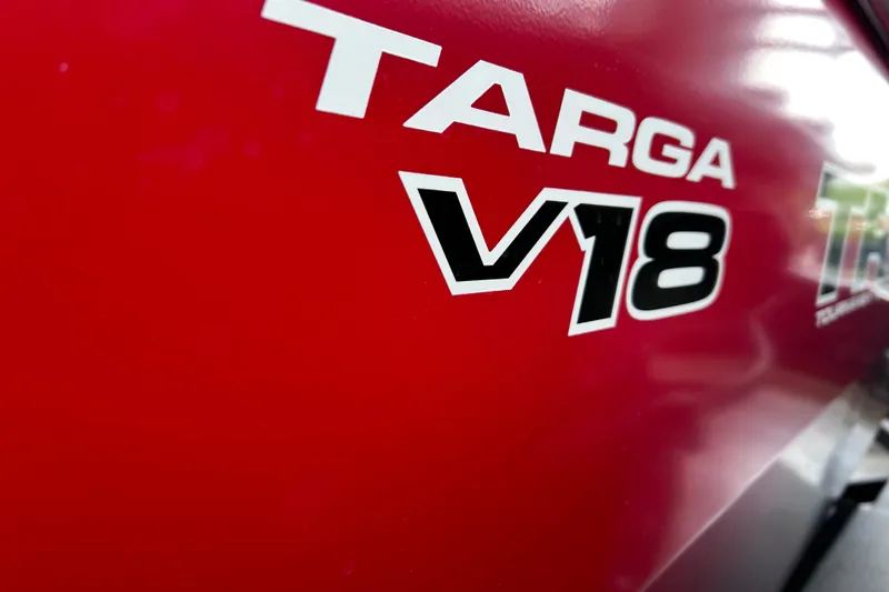 Slide: The Image of Red Tracker Targa V-18 Combo 2026 boat with bold lettering. - 16