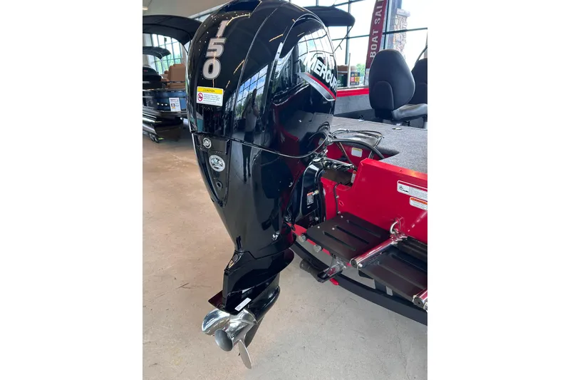 Slide: The Image of 2026 Tracker Targa V-18 Combo boat with Mercury 150 outboard motor, displayed indoors. - 11