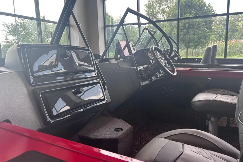 Slide: The Image of Interior of 2026 Tracker Targa V-18 Combo boat with modern dashboard and seating. - 7