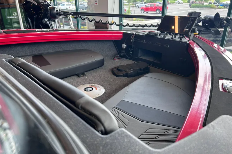 Slide: The Image of Interior of 2026 Tracker Targa V-18 Combo boat with seating and control panel. - 15