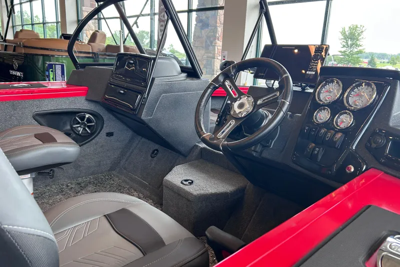 Slide: The Image of Interior view of 2026 Tracker Targa V-18 Combo boat with modern dashboard and steering wheel. - 14