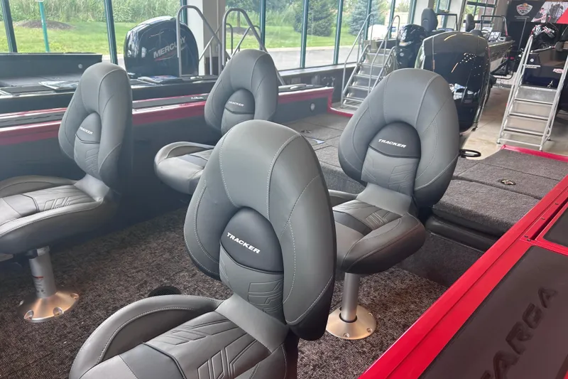 Slide: The Image of 2026 Tracker Targa V-18 Combo boat interior with gray seats and modern design. - 6