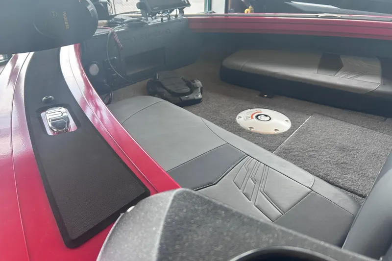 Slide: The Image of Interior view of 2026 Tracker Targa V-18 Combo boat, featuring seating and control panel. - 5