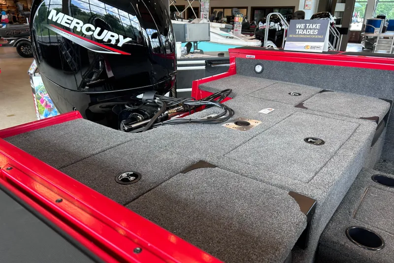 Slide: The Image of 2026 Tracker Targa V-18 Combo boat interior with Mercury engine, showcasing spacious design. - 13