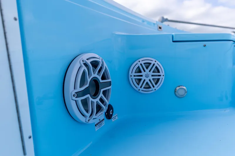 Slide: The Image of 2026 Crevalle 26 HCO boat speakers on a sleek blue interior panel. - 13