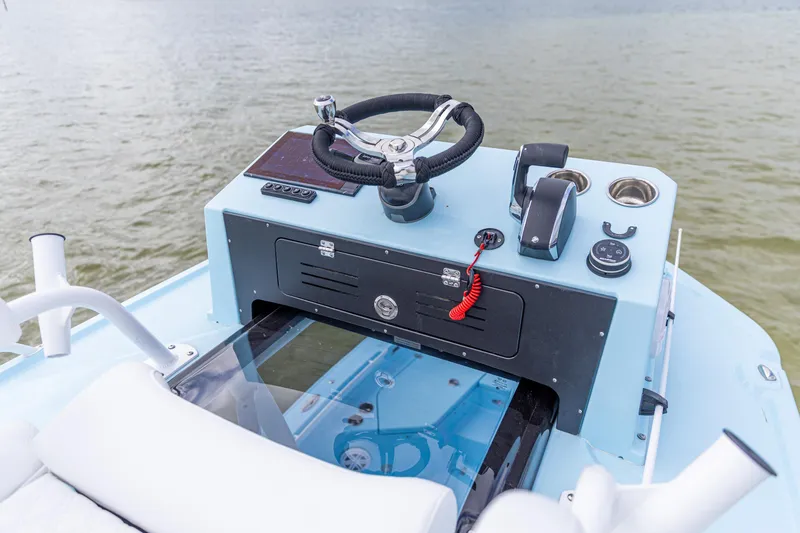 Slide: The Image of Control console of 2026 Crevalle 26 HCO boat on water. - 2