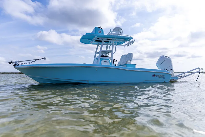Slide: The Image of 2026 Crevalle 26 HCO boat in calm waters under a cloudy sky. - 4