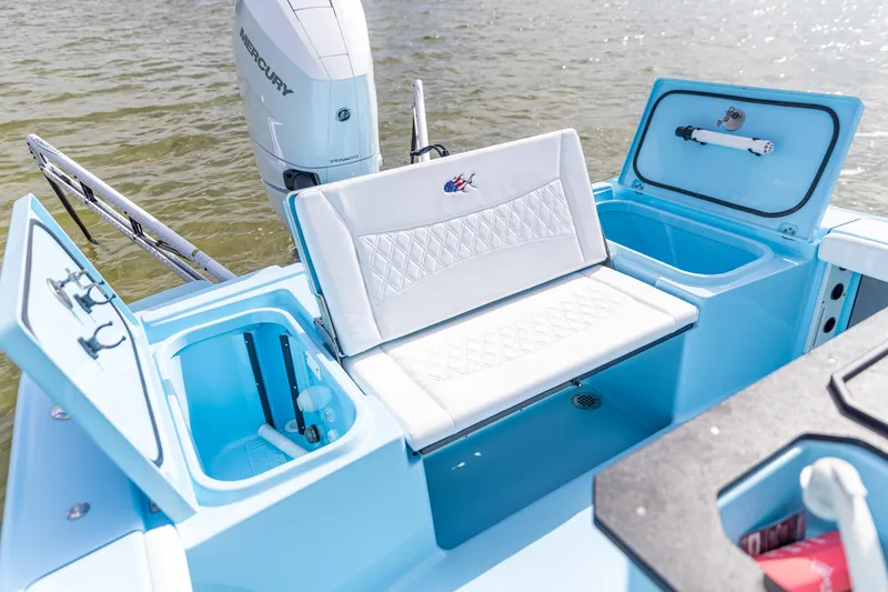 Slide: The Image of 2026 Crevalle 26 HCO boat with Mercury engine, featuring seating and storage compartments. - 6