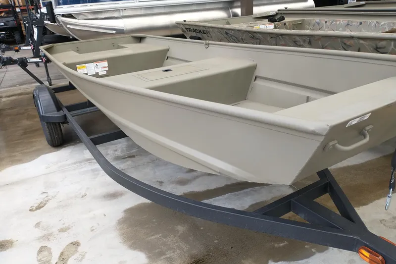 The Image of 2026 Tracker Grizzly 15 Jon boat on trailer in showroom. - 0