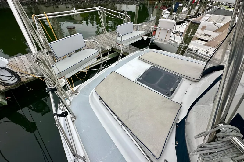Slide: The Image of Hunter Passage 420 sailboat deck, 2002 model, docked with seating and hatch visible. - 10