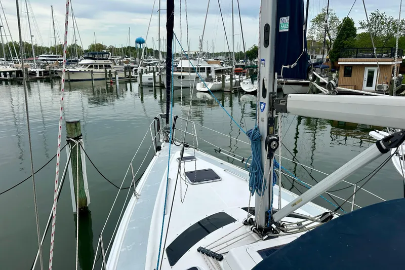 Slide: The Image of Sailboat Hunter Passage 420, 2002 model, docked in a marina with other boats. - 11