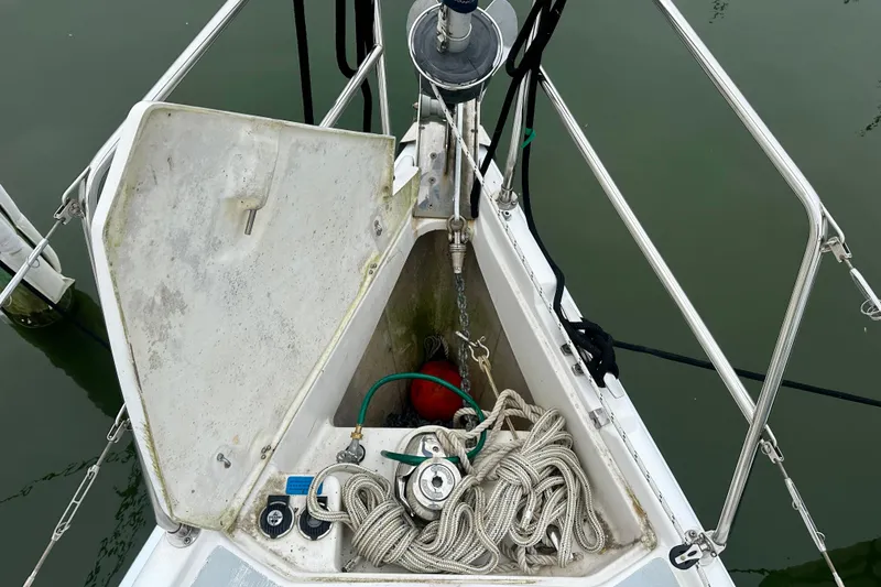 Slide: The Image of Open anchor locker on 2002 Hunter Passage 420 sailboat with ropes and equipment. - 13