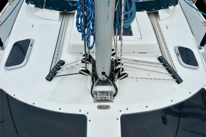 Slide: The Image of Deck view of a 2002 Hunter Passage 420 sailboat with rigging and hatches. - 16