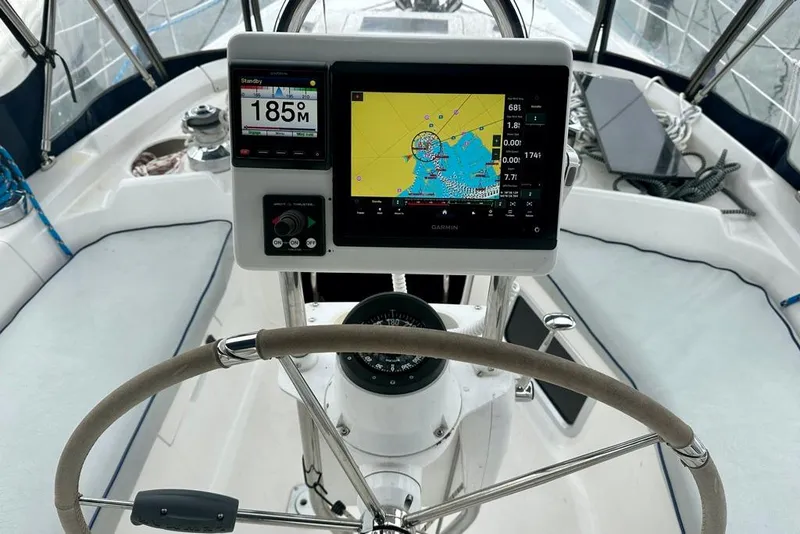 Slide: The Image of Steering wheel and navigation system on a 2002 Hunter Passage 420 sailboat. - 17