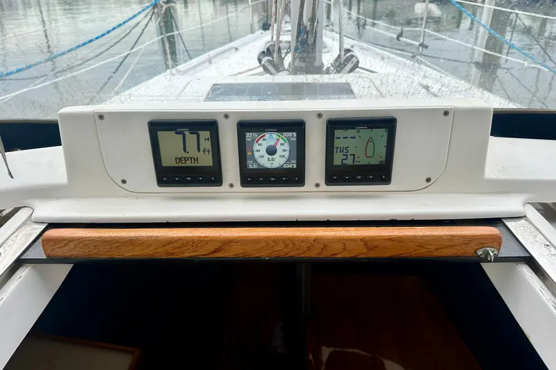 Slide: The Image of Control panel of a 2002 Hunter Passage 420 sailboat with navigation instruments. - 18