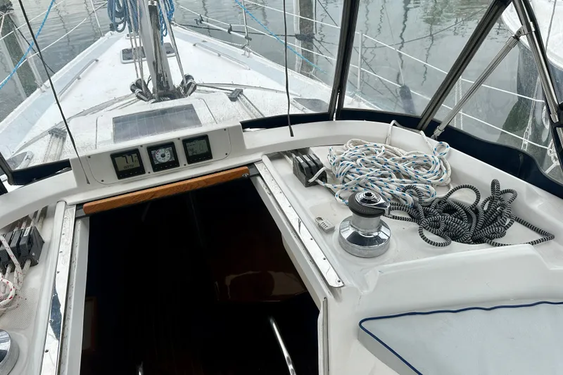 Slide: The Image of Cockpit view of 2002 Hunter Passage 420 sailboat with ropes and navigation instruments. - 19