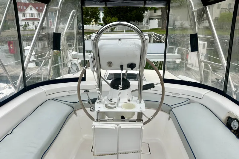 Slide: The Image of Cockpit of 2002 Hunter Passage 420 sailboat with steering wheel and seating. - 20