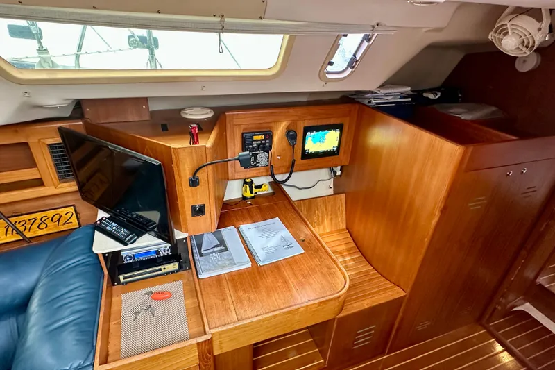 Slide: The Image of Interior of 2002 Hunter Passage 420 yacht with navigation station and electronics. - 26