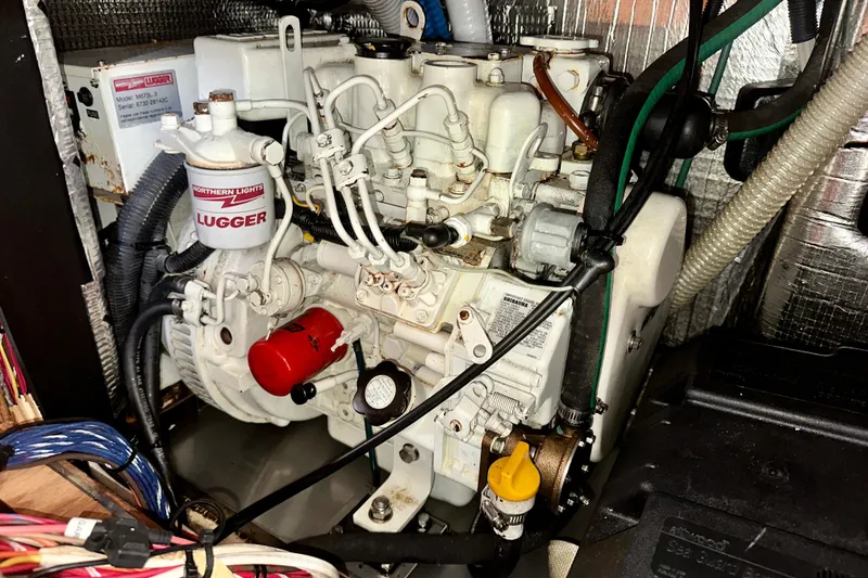 Slide: The Image of Engine compartment of a 2002 Hunter Passage 420 sailboat, featuring a Northern Lights Lugger engine. - 30