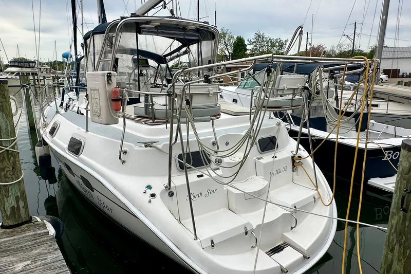 Slide: The Image of Hunter Passage 420 sailboat, 2002 model, docked at a marina with visible rigging. - 4