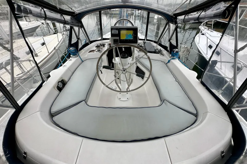 Slide: The Image of Cockpit of 2002 Hunter Passage 420 sailboat with steering wheel and navigation system. - 8