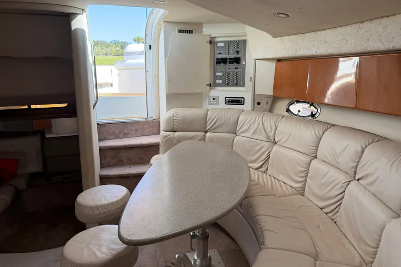 Slide: The Image of Interior of a 2000 Formula 41 Performance Cruiser with plush seating and modern amenities. - 11