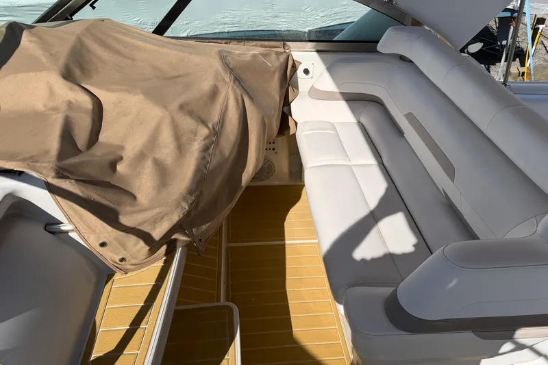 Slide: The Image of Interior of a 2000 Formula 41 Performance Cruiser with beige seating and cover. - 15