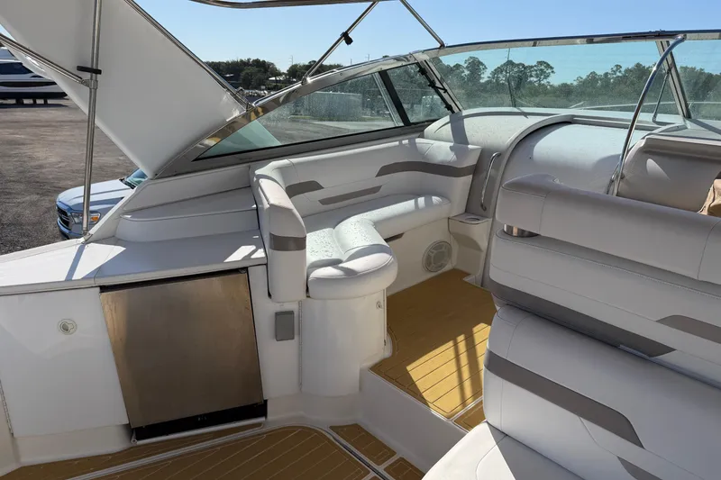 Slide: The Image of Interior of a 2000 Formula 41 Performance Cruiser with white seating and wood flooring. - 16