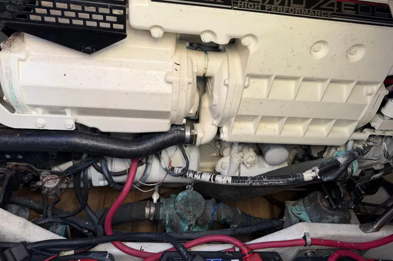 Slide: The Image of Engine compartment of a 2000 Formula 41 Performance Cruiser with visible hoses and components. - 21