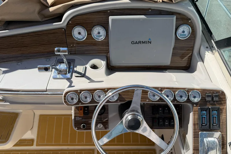 Slide: The Image of Cockpit of 2000 Formula 41 Performance Cruiser with Garmin navigation system and gauges. - 7