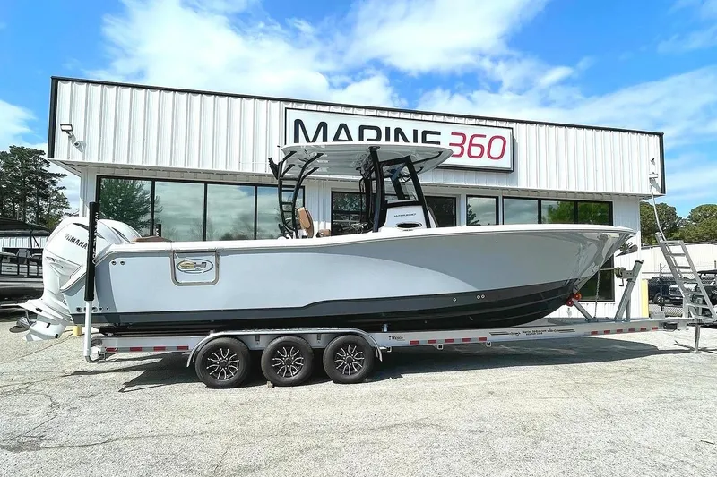 The Image of 2026 Seahunt Ultra 305 CB boat on trailer at Marine 360 dealership. - 0