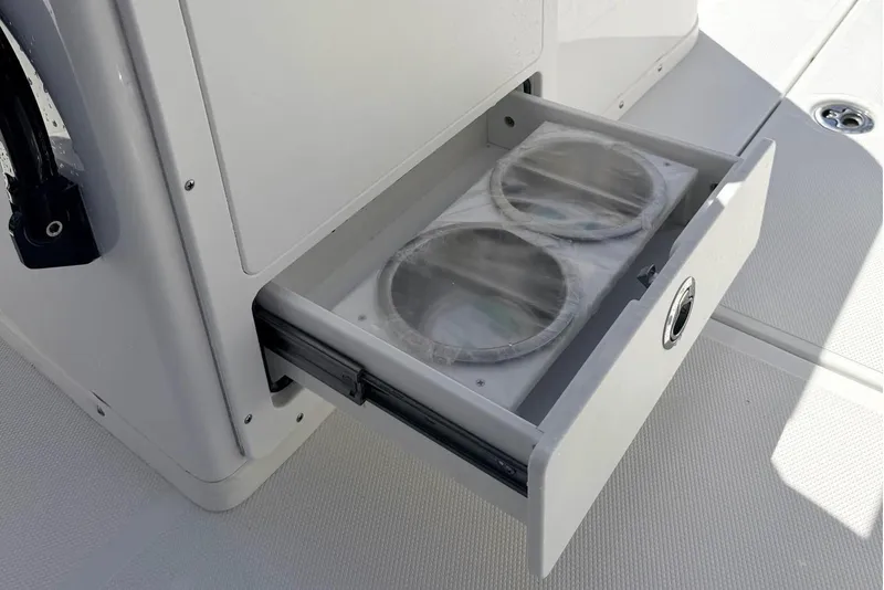 Slide: The Image of Sea Hunt Ultra 305 Coffin Box 2026 with open storage compartment. - 11