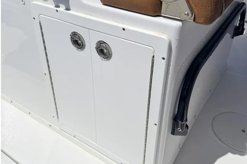Slide: The Image of Sea Hunt Ultra 305 Coffin Box 2026, white boat cabin. - 13
